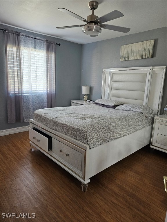 bedroom featuring dark hardwood / wood-style flooring and ceiling fan