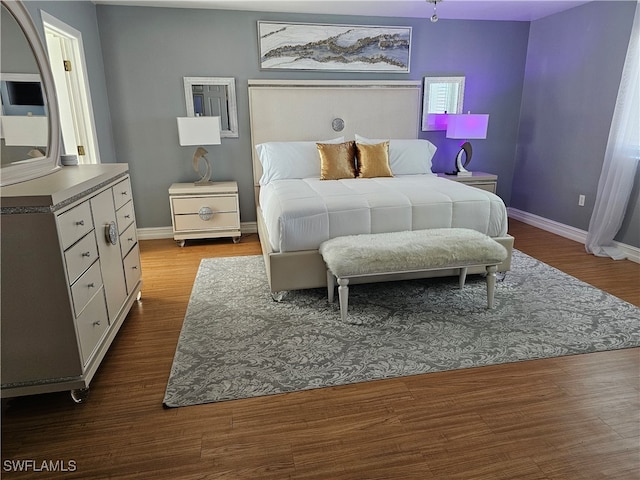 bedroom with wood-type flooring