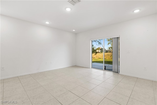 empty room featuring light tile patterned floors