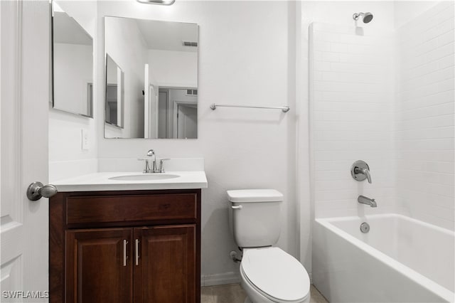 full bathroom featuring toilet, vanity, and tiled shower / bath