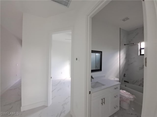 bathroom with vanity and tiled shower / bath combo