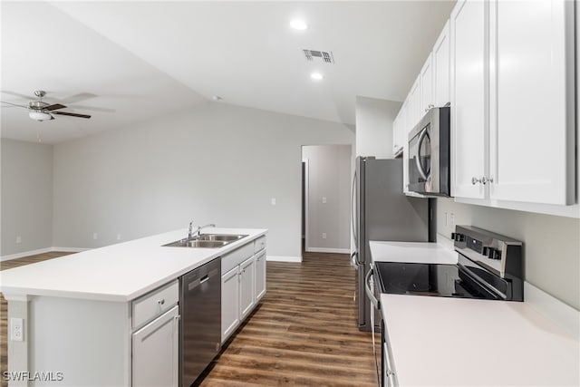 kitchen with stainless steel appliances, dark wood-type flooring, sink, white cabinetry, and an island with sink