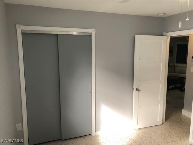 unfurnished bedroom featuring a closet