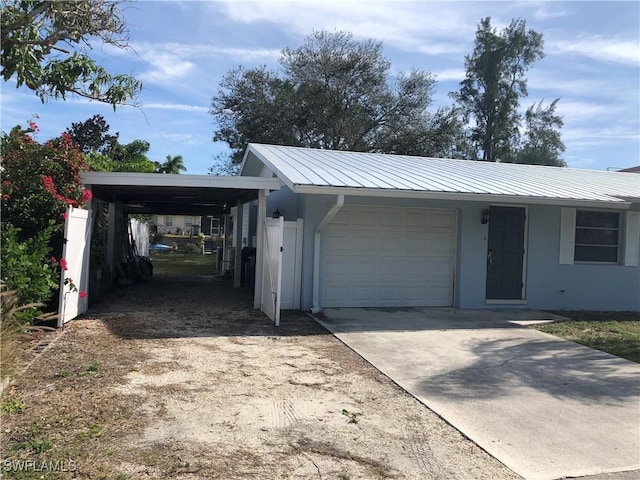 garage featuring a carport