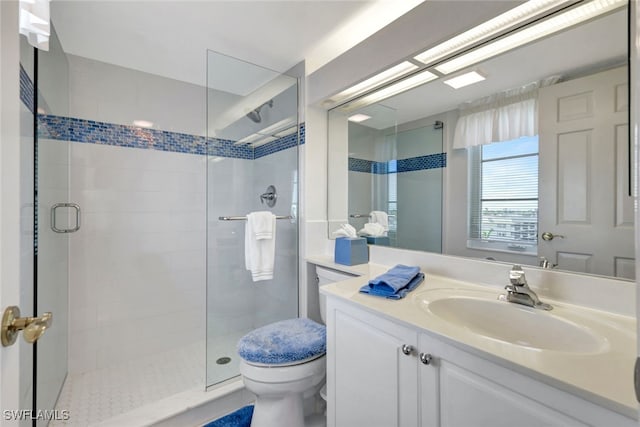 bathroom with vanity, toilet, and walk in shower