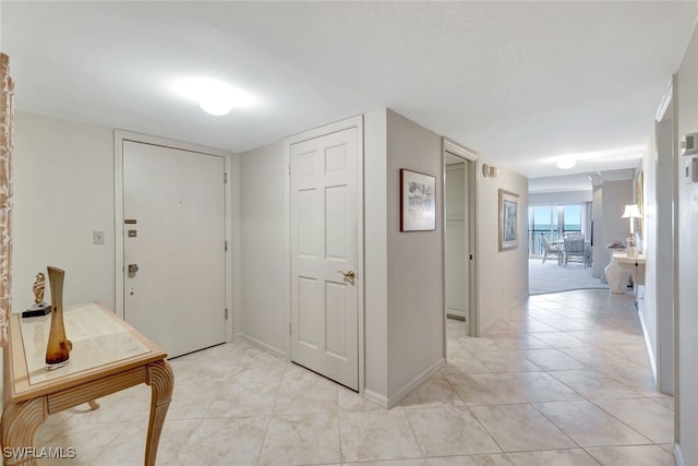 entrance foyer with light tile patterned floors