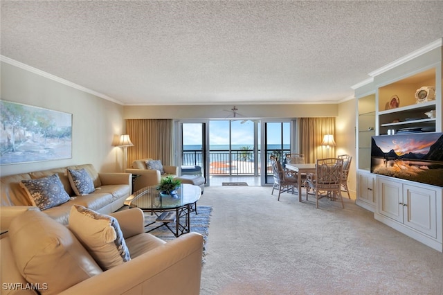 living room featuring crown molding, carpet floors, and a textured ceiling