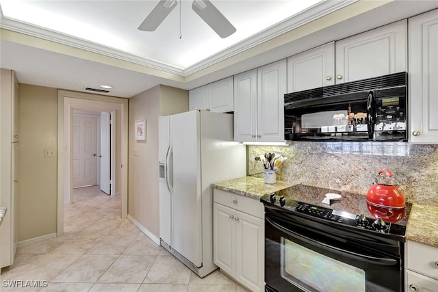 kitchen with white cabinetry, decorative backsplash, and black appliances