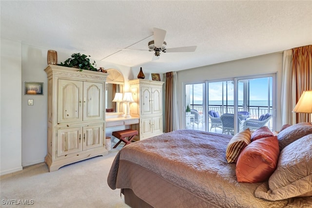 bedroom with light carpet, a textured ceiling, access to outside, and ceiling fan