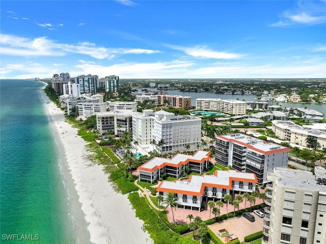 birds eye view of property featuring a view of the beach and a water view