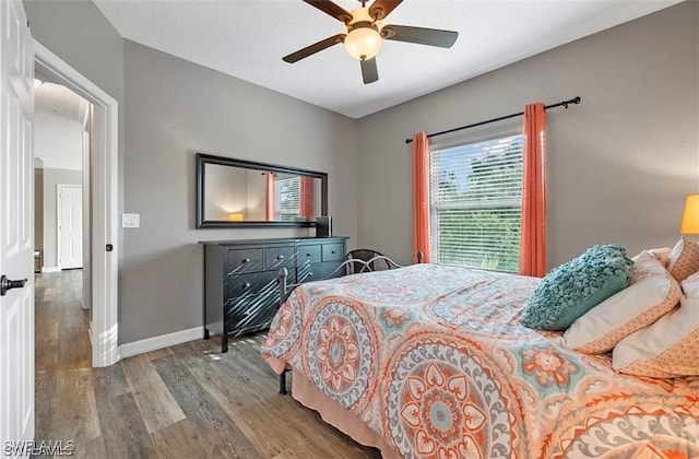 bedroom featuring ceiling fan and wood-type flooring