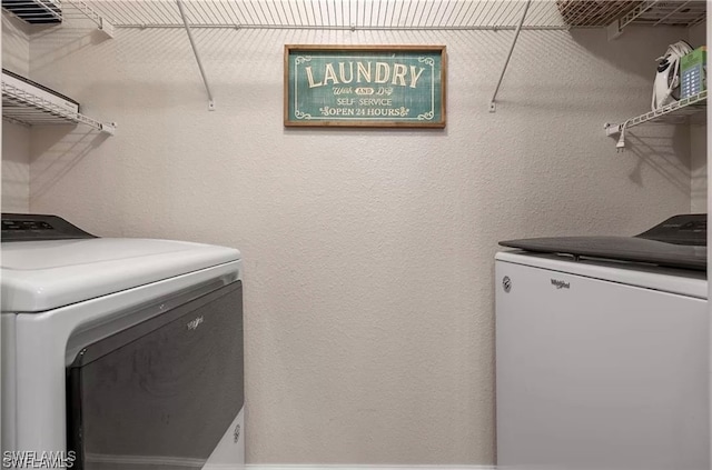 laundry area with independent washer and dryer