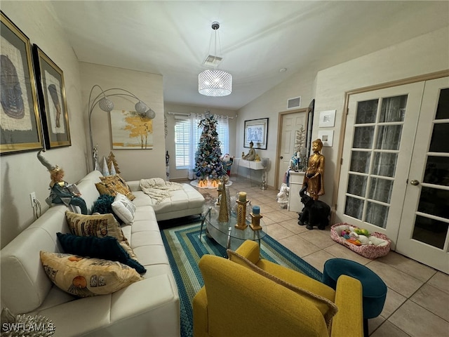 tiled living room featuring french doors and lofted ceiling