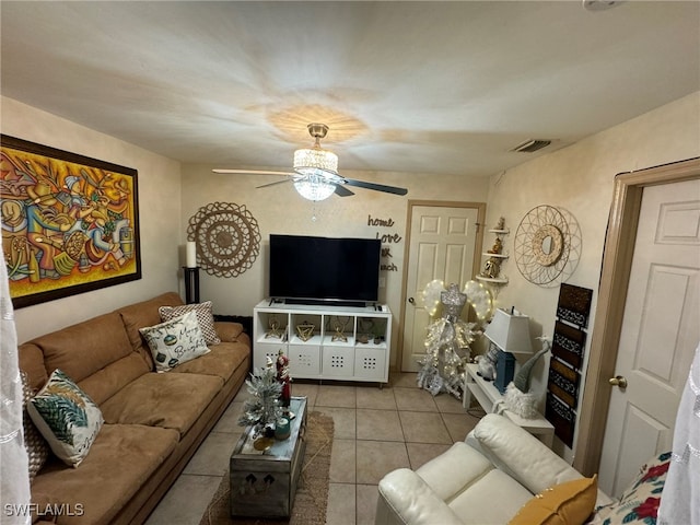 tiled living room featuring ceiling fan