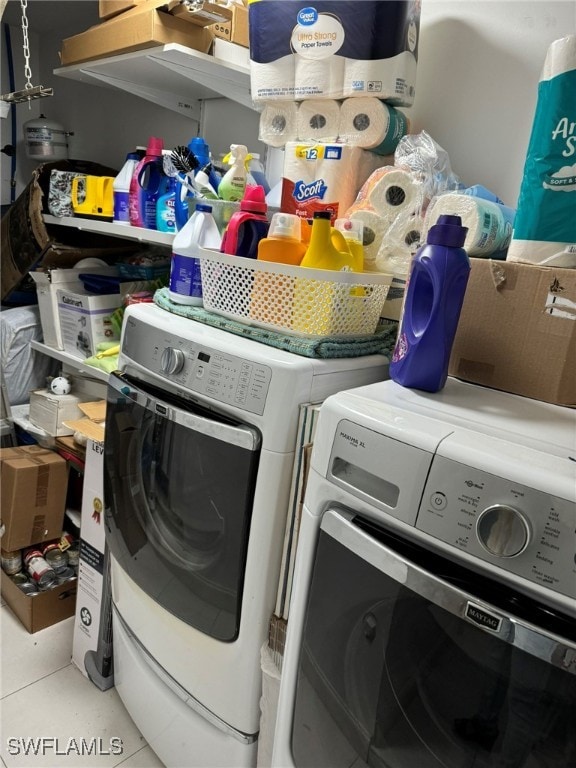 laundry area with washing machine and clothes dryer