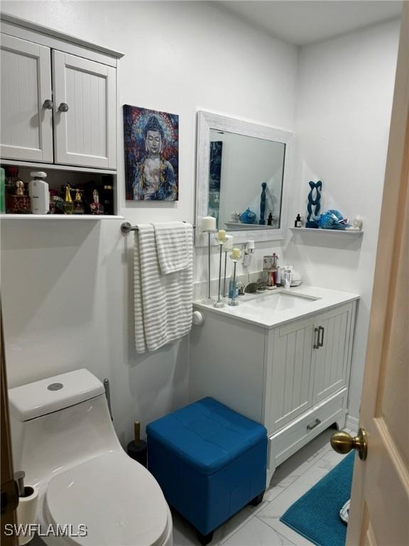 bathroom with vanity and toilet