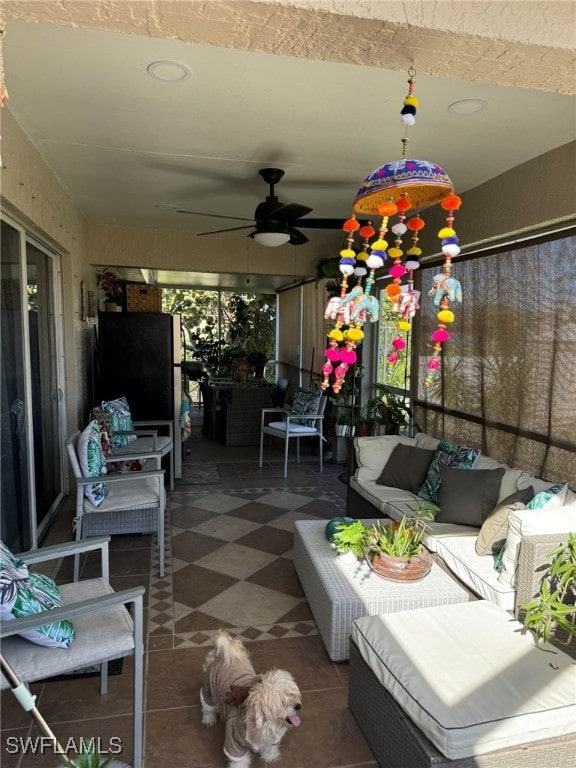 exterior space with outdoor lounge area and ceiling fan