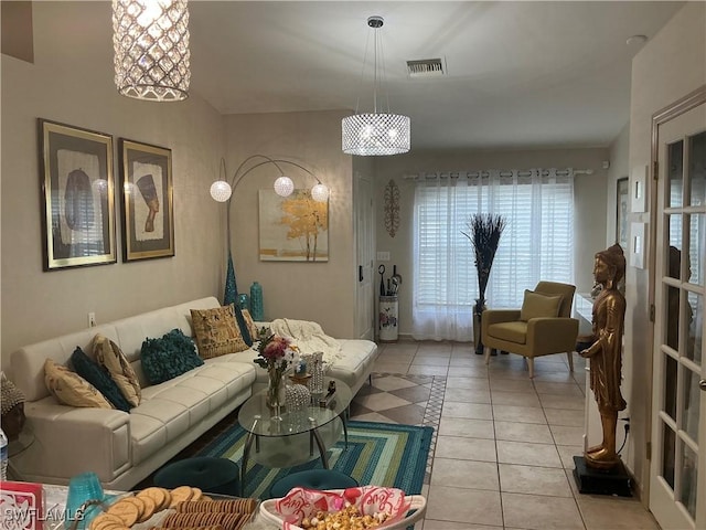 living area with light tile patterned floors and visible vents