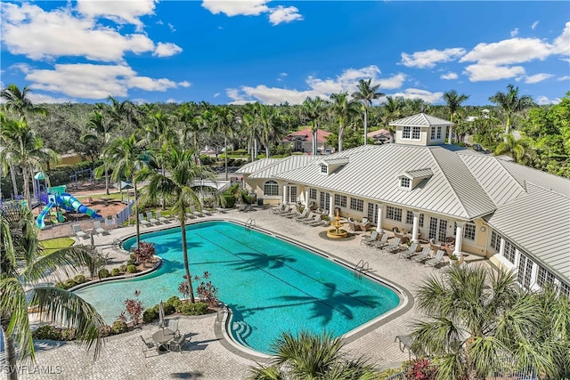 view of pool featuring french doors and a patio