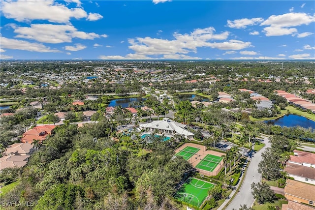 birds eye view of property with a water view