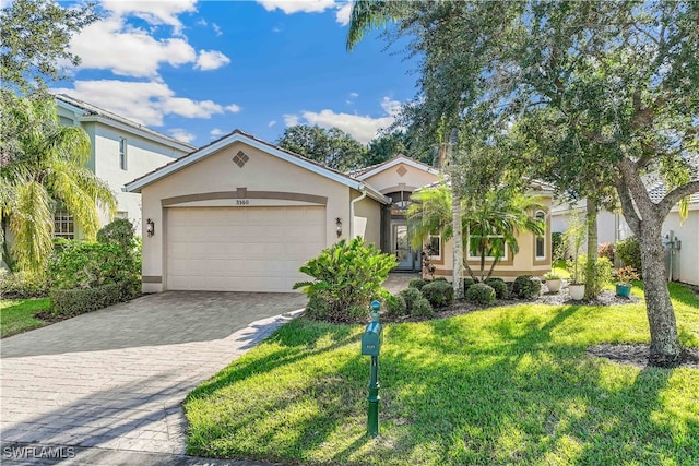 view of front of house featuring a garage and a front yard