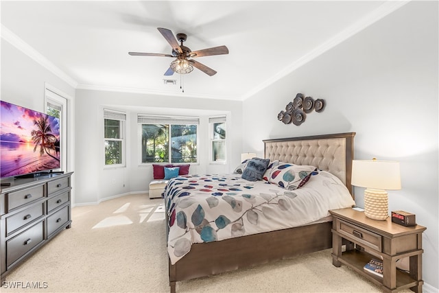 bedroom with light colored carpet, ceiling fan, and crown molding