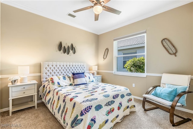 bedroom with ceiling fan, crown molding, and light colored carpet