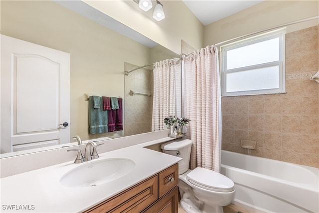 full bathroom featuring vanity, toilet, and shower / bathtub combination with curtain