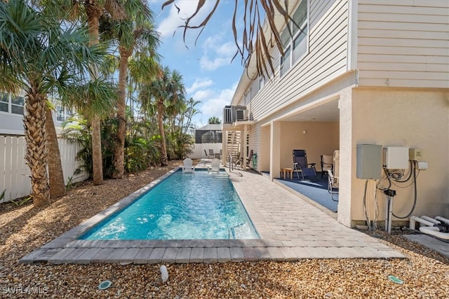 view of pool featuring a fenced backyard, stairs, a fenced in pool, and a patio