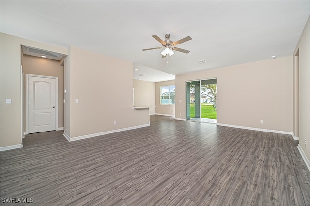 unfurnished living room featuring ceiling fan and dark hardwood / wood-style floors