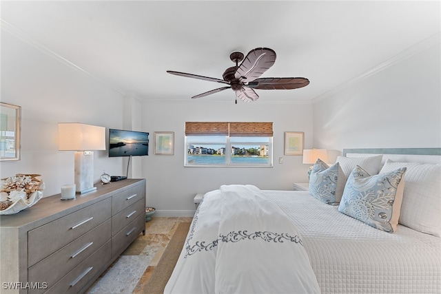 bedroom featuring ceiling fan and crown molding