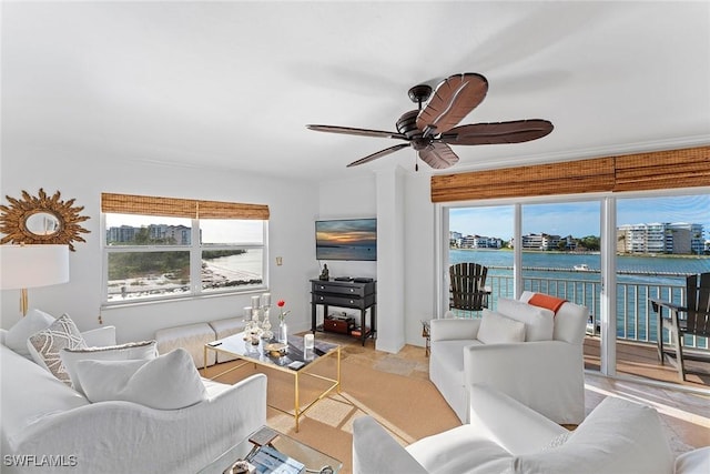 living room with ceiling fan and light hardwood / wood-style flooring