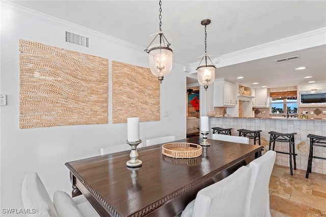 dining room with crown molding