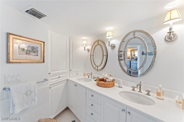 bathroom with tile patterned flooring and vanity