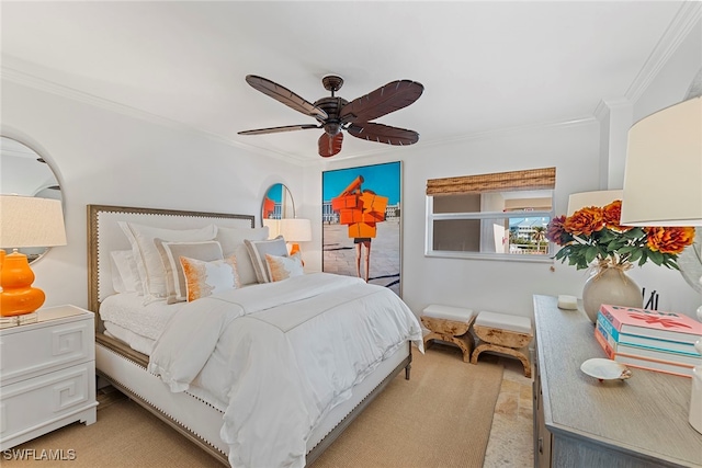 bedroom with ceiling fan, crown molding, and light carpet