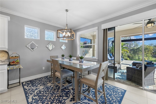 dining space featuring light tile patterned floors, crown molding, plenty of natural light, and a notable chandelier