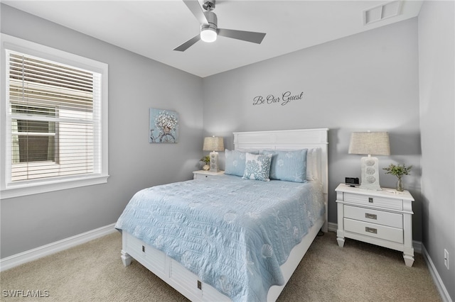 carpeted bedroom featuring ceiling fan