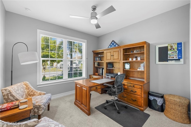 office area featuring light colored carpet and ceiling fan