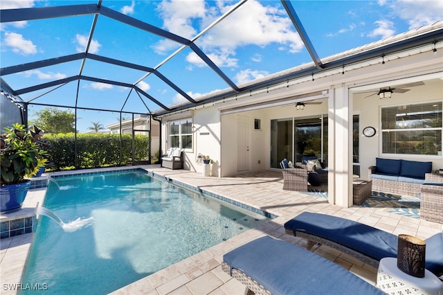 view of pool featuring a lanai, ceiling fan, outdoor lounge area, a patio, and pool water feature