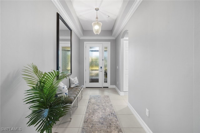 doorway to outside featuring ornamental molding and light tile patterned floors