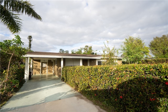 exterior space with a carport