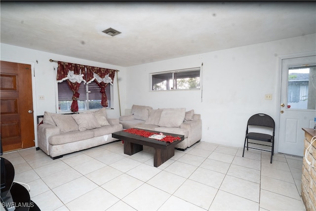 living room featuring a healthy amount of sunlight and light tile patterned floors