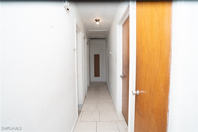 hallway featuring light tile patterned floors