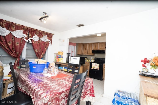 dining area featuring light tile patterned floors