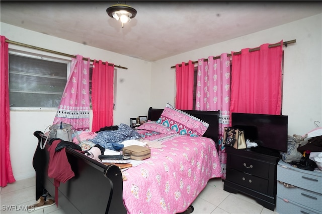 bedroom featuring light tile patterned floors