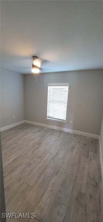 spare room with light hardwood / wood-style floors