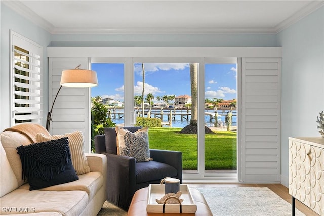 sunroom featuring a healthy amount of sunlight and a water view