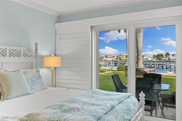 bedroom with access to outside, a water view, and crown molding