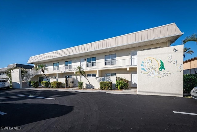 843 SE 46th Ln Unit 1, Cape Coral, FL 33904 - view of building exterior with uncovered parking