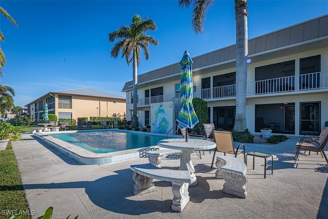 view of pool featuring a patio